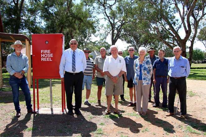 Image: Mayor Paul Harmon (left) joins the committee of Inverell Pioneer Village to inspect new fire protection equipment.